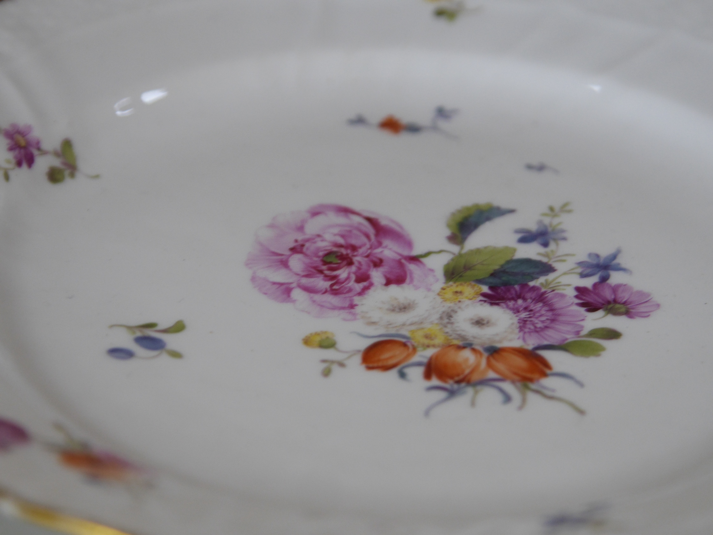 A 19th century Copenhagen floral and gilt decorated part dessert service, dishes 23cm wide. Condition - gilt edging worn